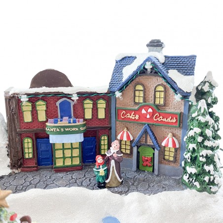 Villaggio Natalizio Innevato 361038 Giostra con Luci Suoni Movimento 37x21x27 cm