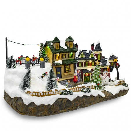 Villaggio Natalizio Innevato 361015 Giostra Luci Suoni e Movimento 37x16x18 CM