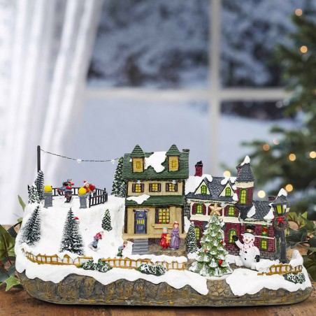 Villaggio Natalizio Innevato 361015 Giostra Luci Suoni e Movimento 37x16x18 CM
